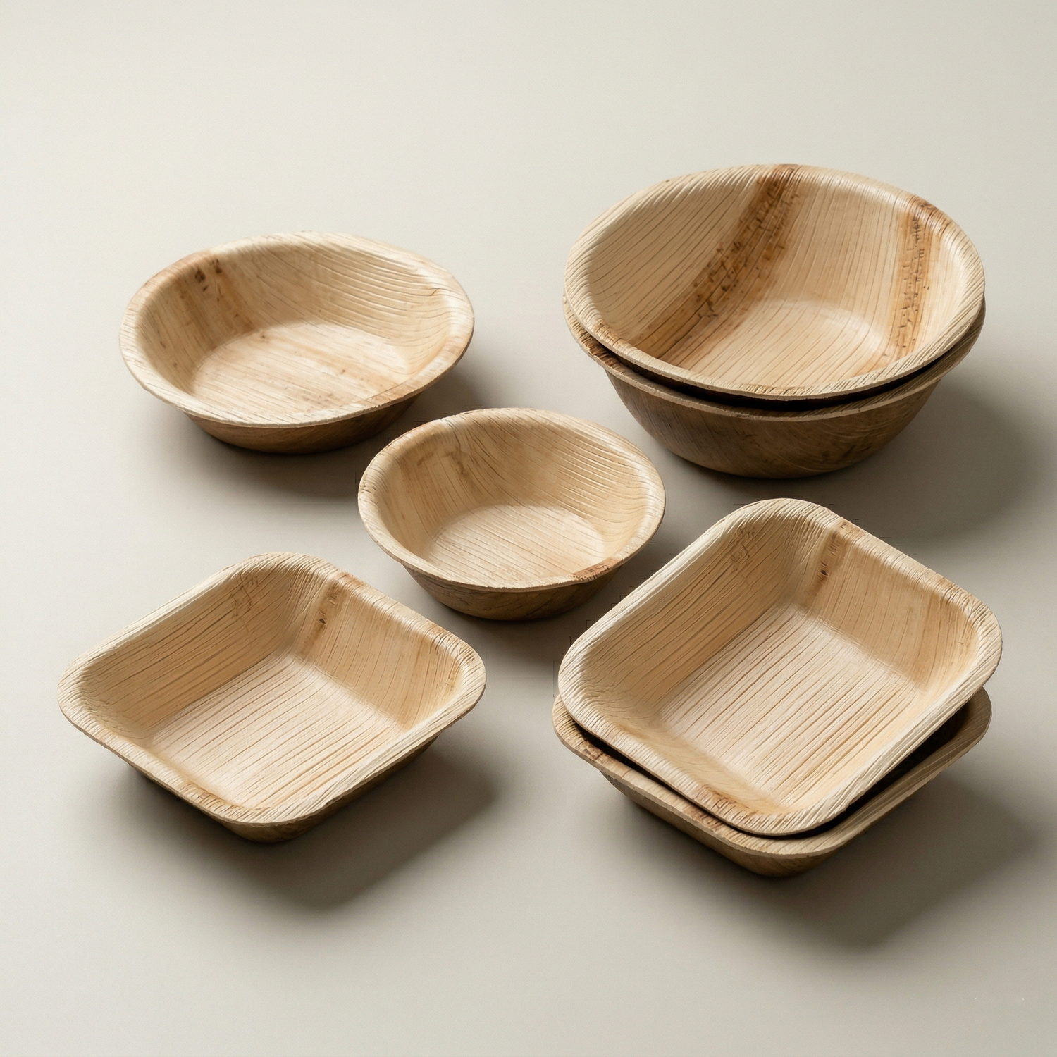 natural areca palm leaf bowl collection with square bowls and round bowls compostable sustainable kitchenware